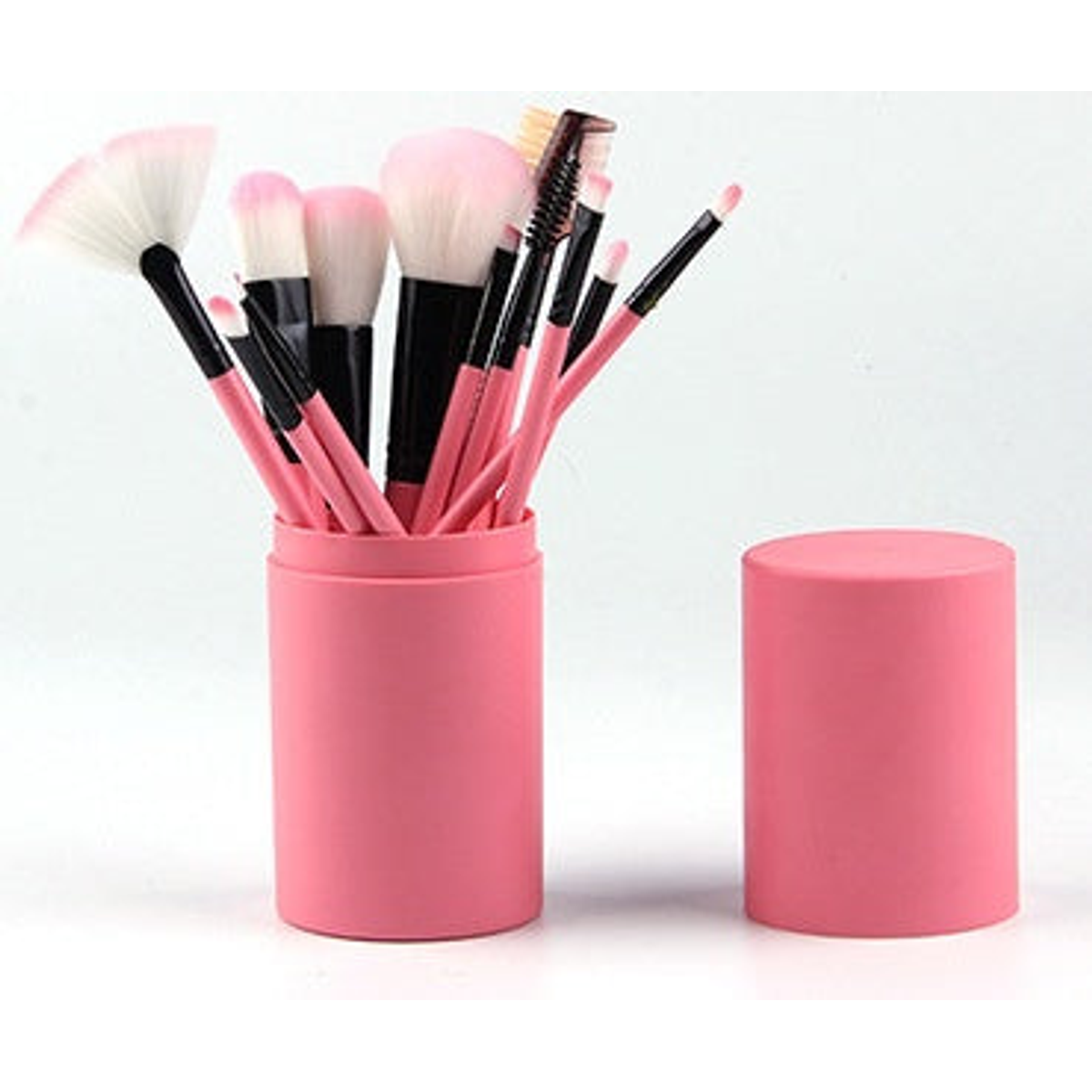 Rose-pink makeup brush set shown upright in a matching cylindrical case